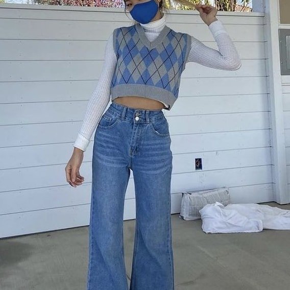 Wde leg jeans worn with vest and turtle neck
