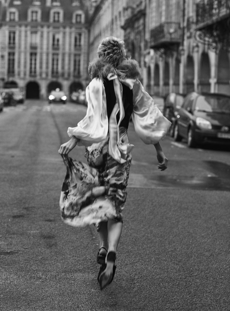 Back of a woman running elegantly down the streetStyled by M Ayoubi