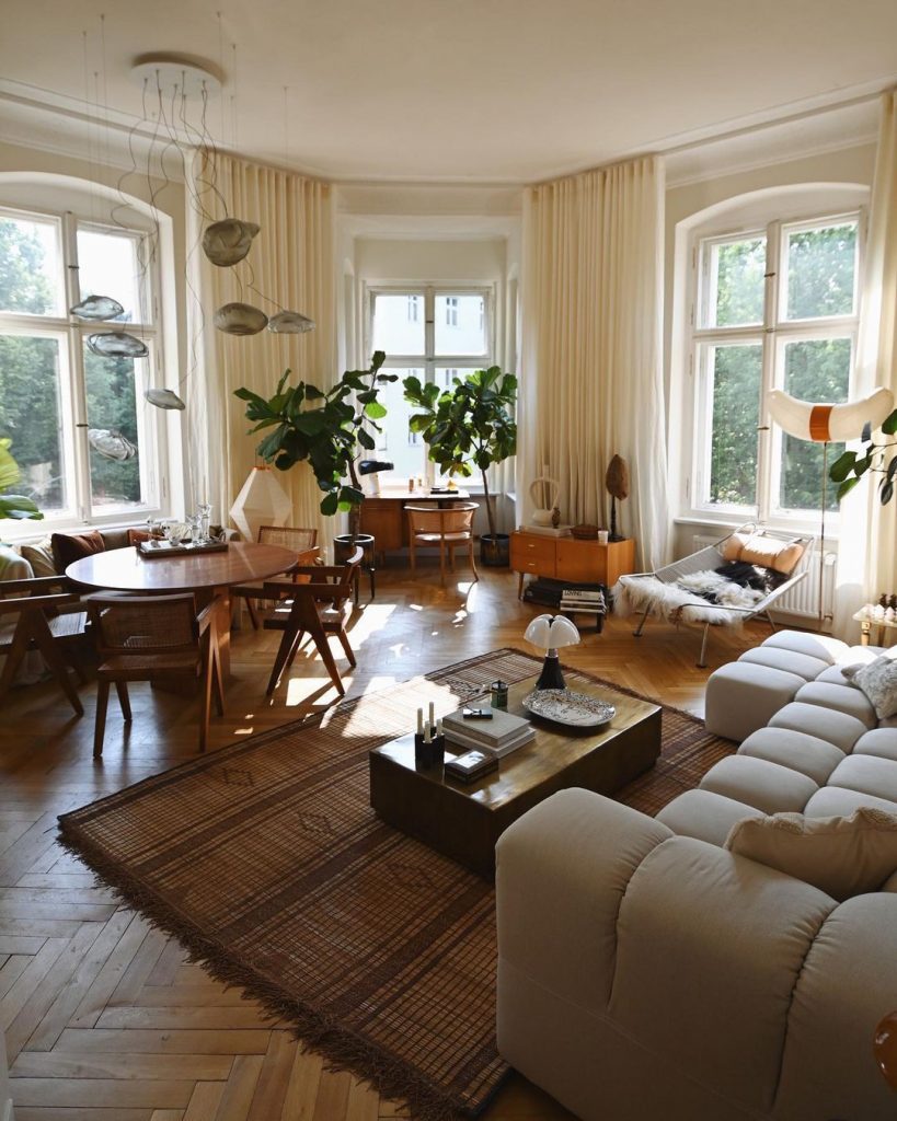 Renovated lounge room with easy furniture and large bay windows