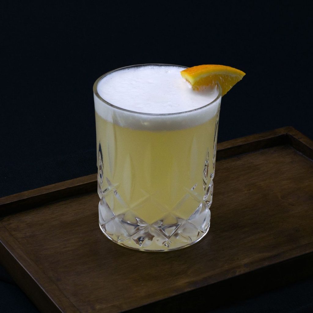 Crystal glass of Gin Fizz made from an easy cocktail recipe