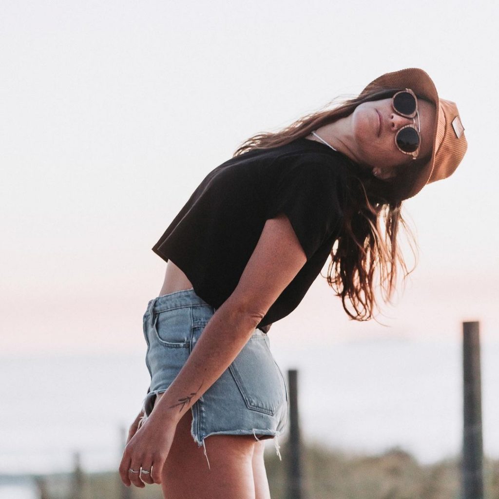 Sustainable Australian Sunglasses brands Archer, backwards bending woman